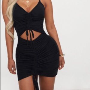 Shaped black ribbed mini dress
